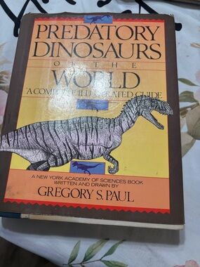Predatory Dinosaurs of the World by - Yellow/Brown Cover